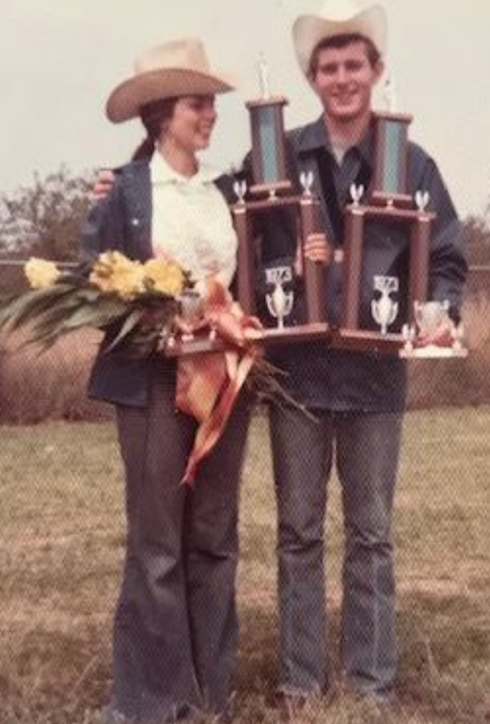 A couple holding their trophies
