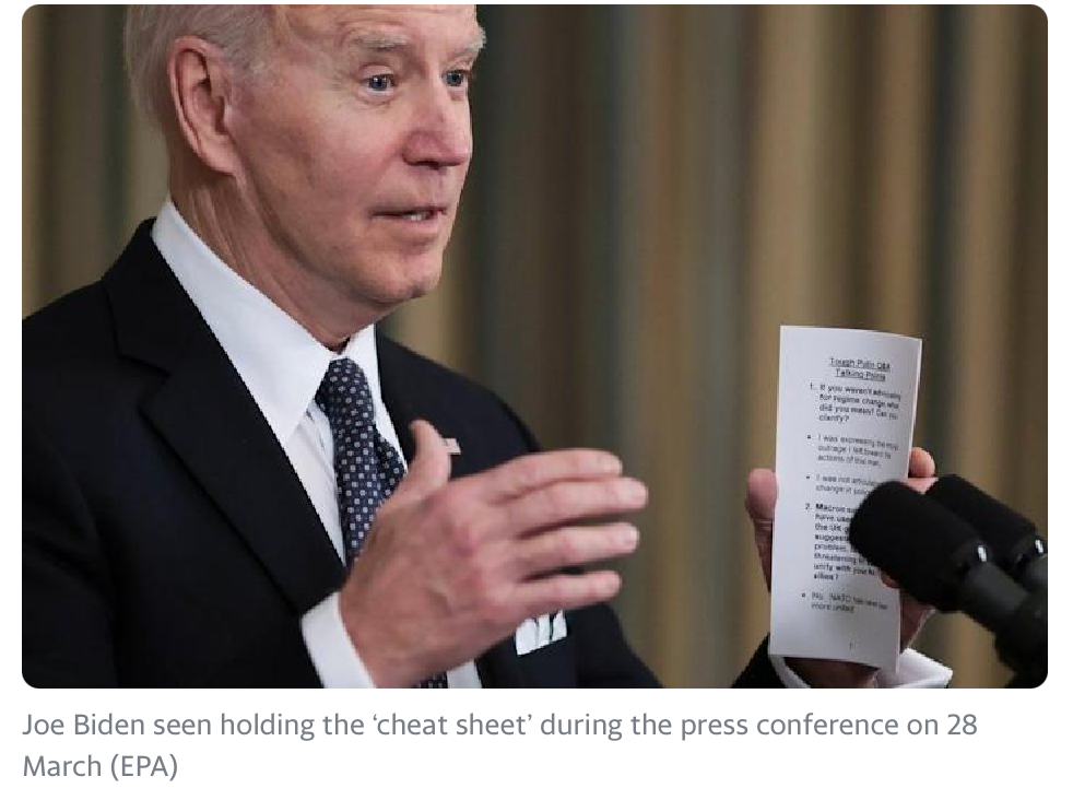 Joe Biden holding a cheat sheet