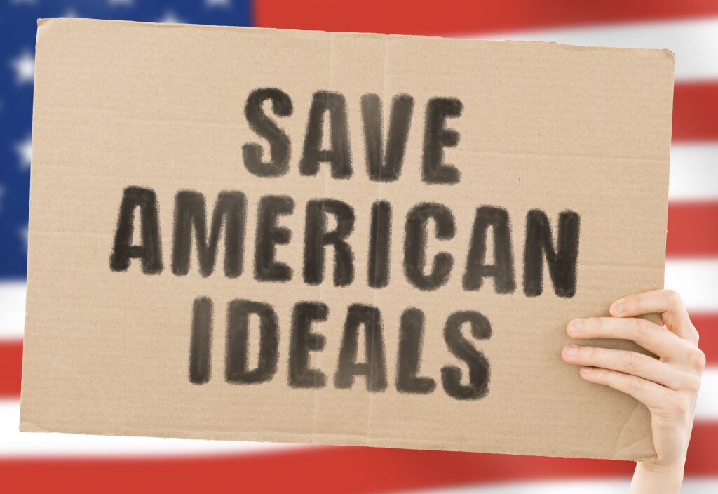 Save American Ideals text on a cardboard