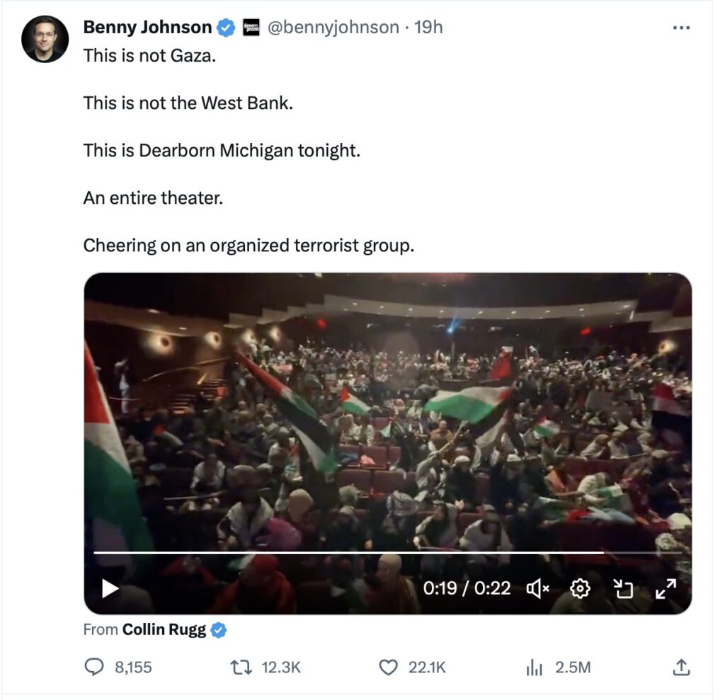 A tweet with a picture of a crowd of people with flags.