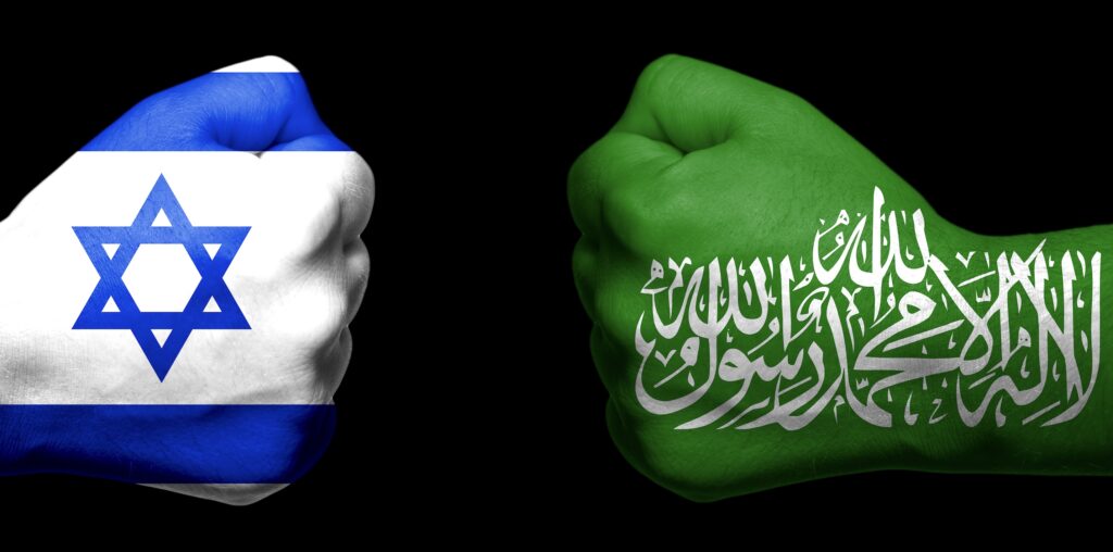 Two fists with the israeli and saudi flags painted on them.