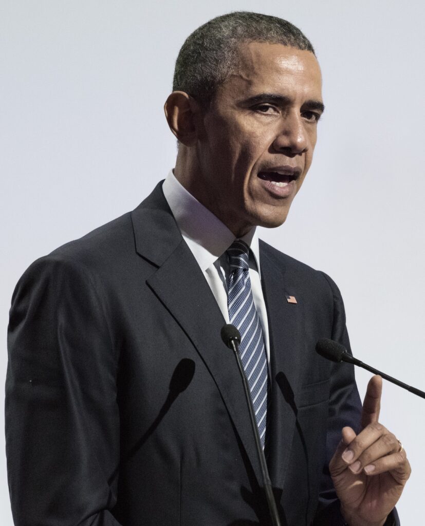 President barack obama speaks at a podium.