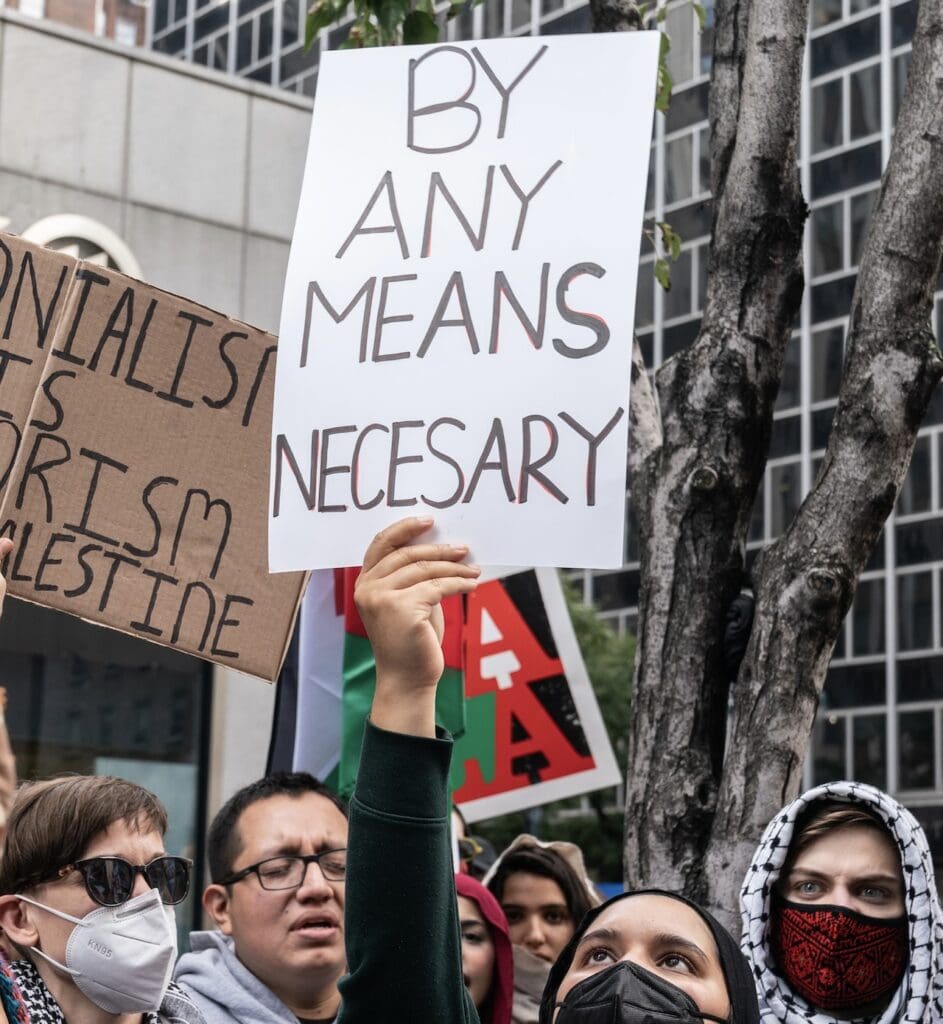 People holding signs at a protest.