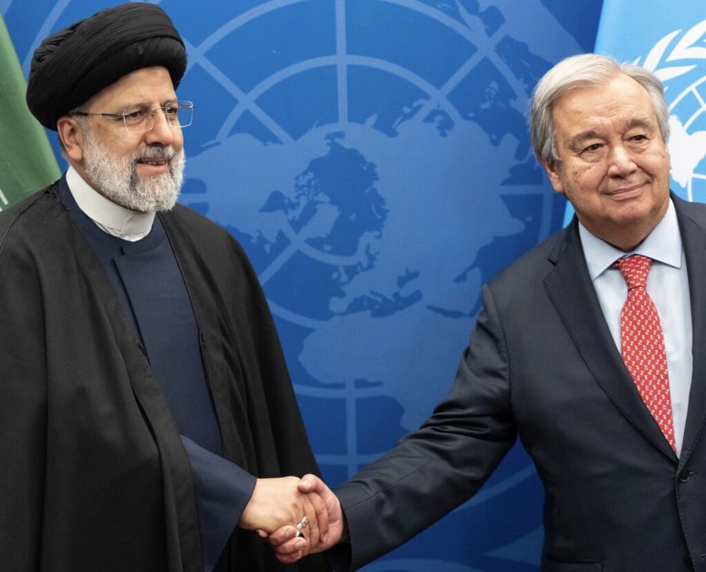 Iranian Foreign Minister shakes hands with UN Secretary-General.